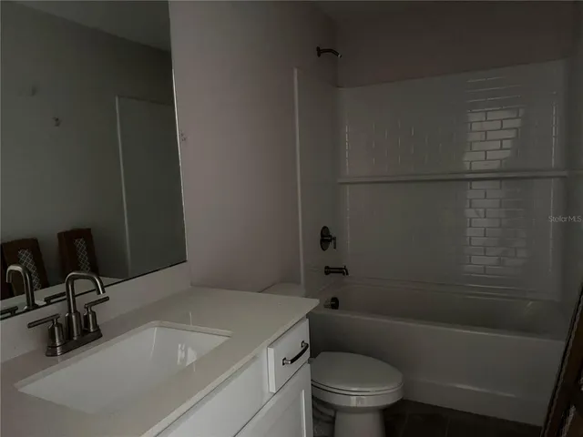 a room with a window and a wooden floor