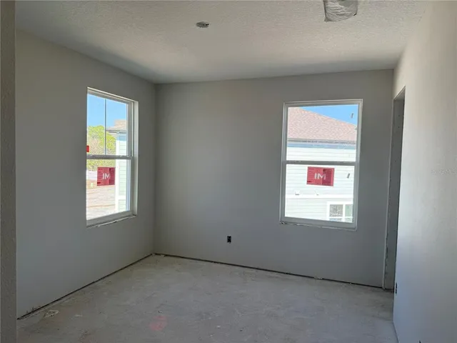 a view of swimming pool with outdoor seating and lake view
