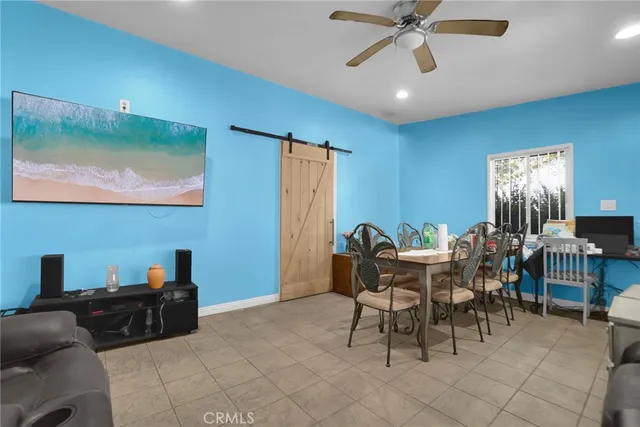 a kitchen with stainless steel appliances granite countertop a refrigerator sink and stove