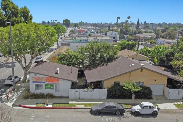 an aerial view of a house with garden space and houses