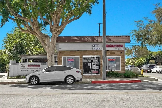 a view of a kitchen with dining table and chairs