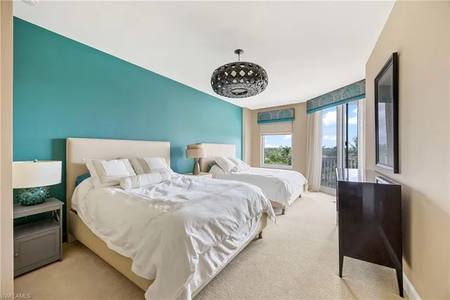 a bedroom with bed and a window