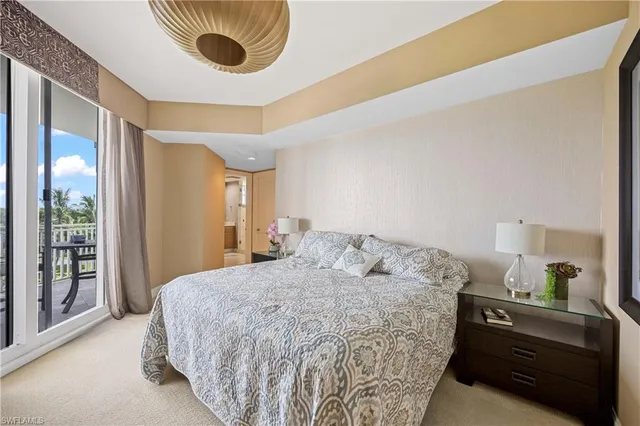 a bedroom with a bed and a mirror