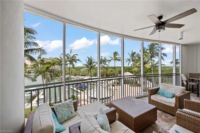 a view of a living room and a balcony