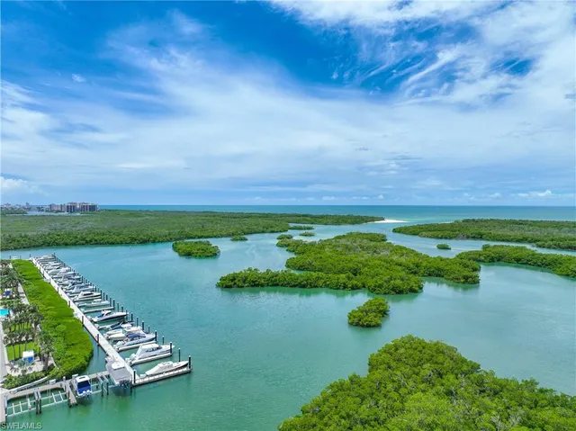 a house with swimming pool and outdoor seating