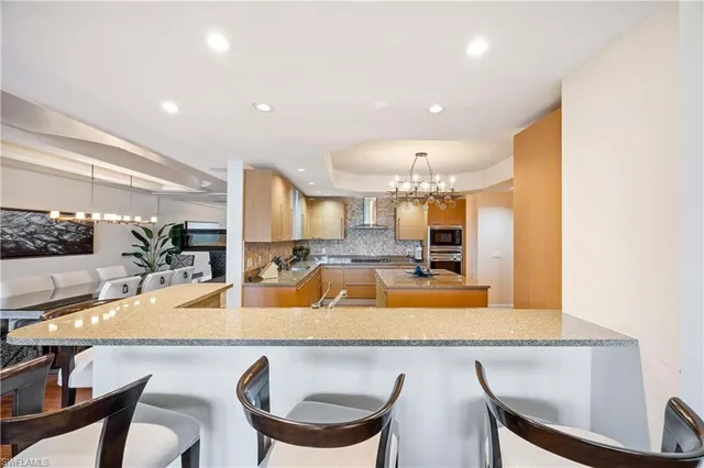 a view of a dining room with furniture and a large window