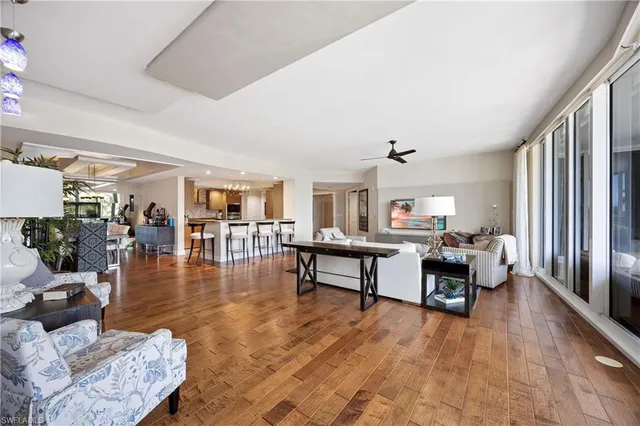 a living room with fireplace furniture and a wooden floor