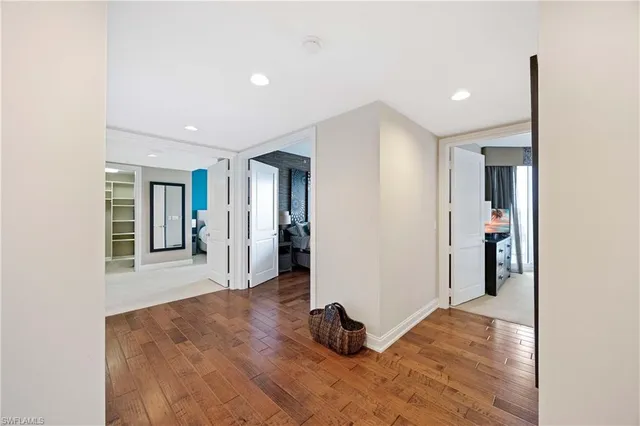 a view of a room with wooden floor and a window