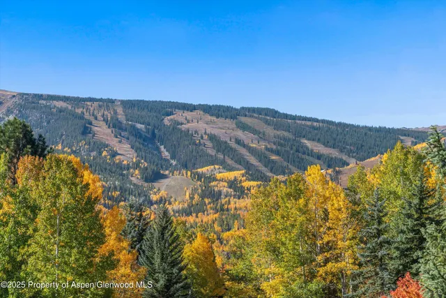 a view of mountain with sunset
