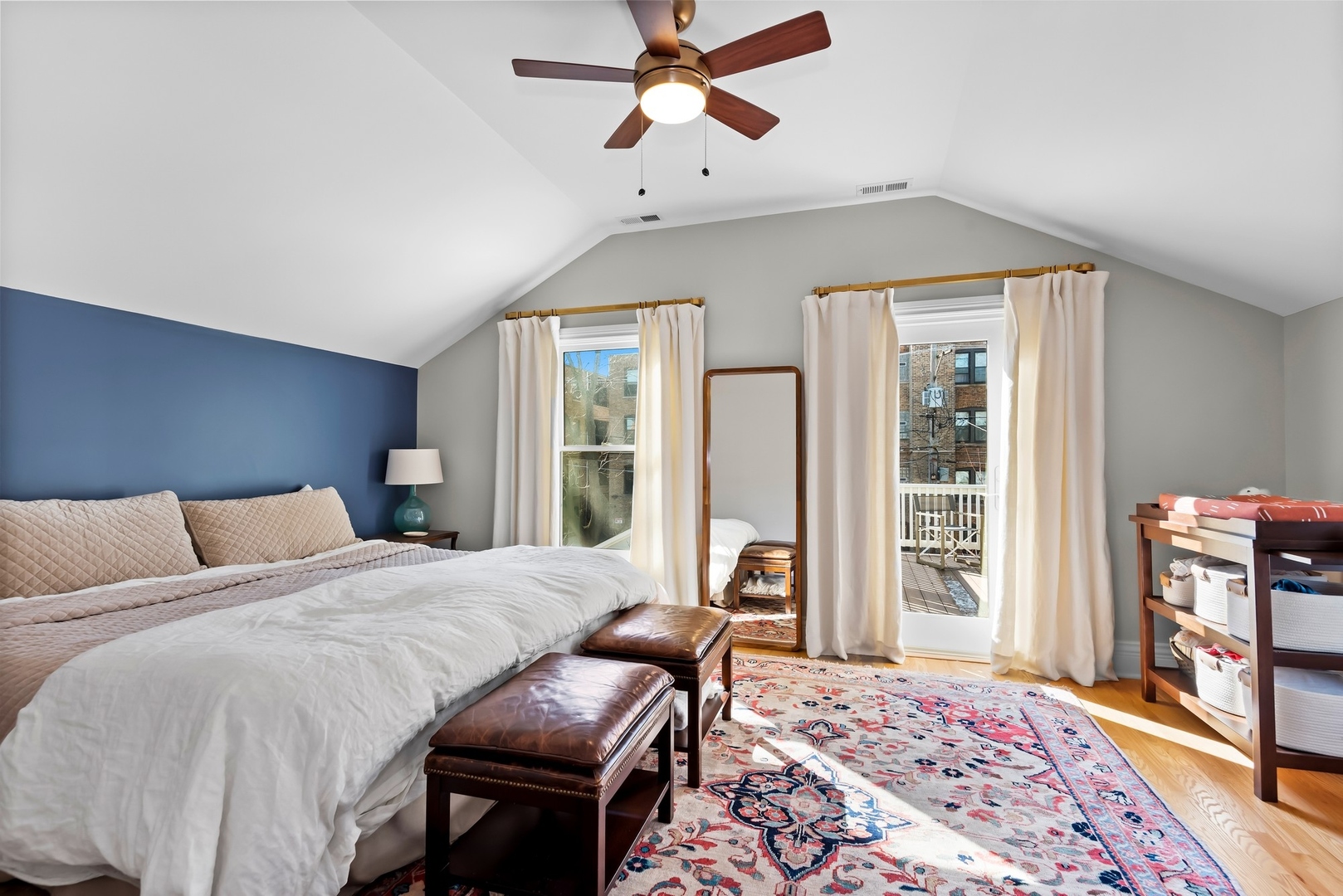 Undisclosed Address Evanston, IL 60201 - Photo 14 of 27 a bedroom with a bed and wooden floor