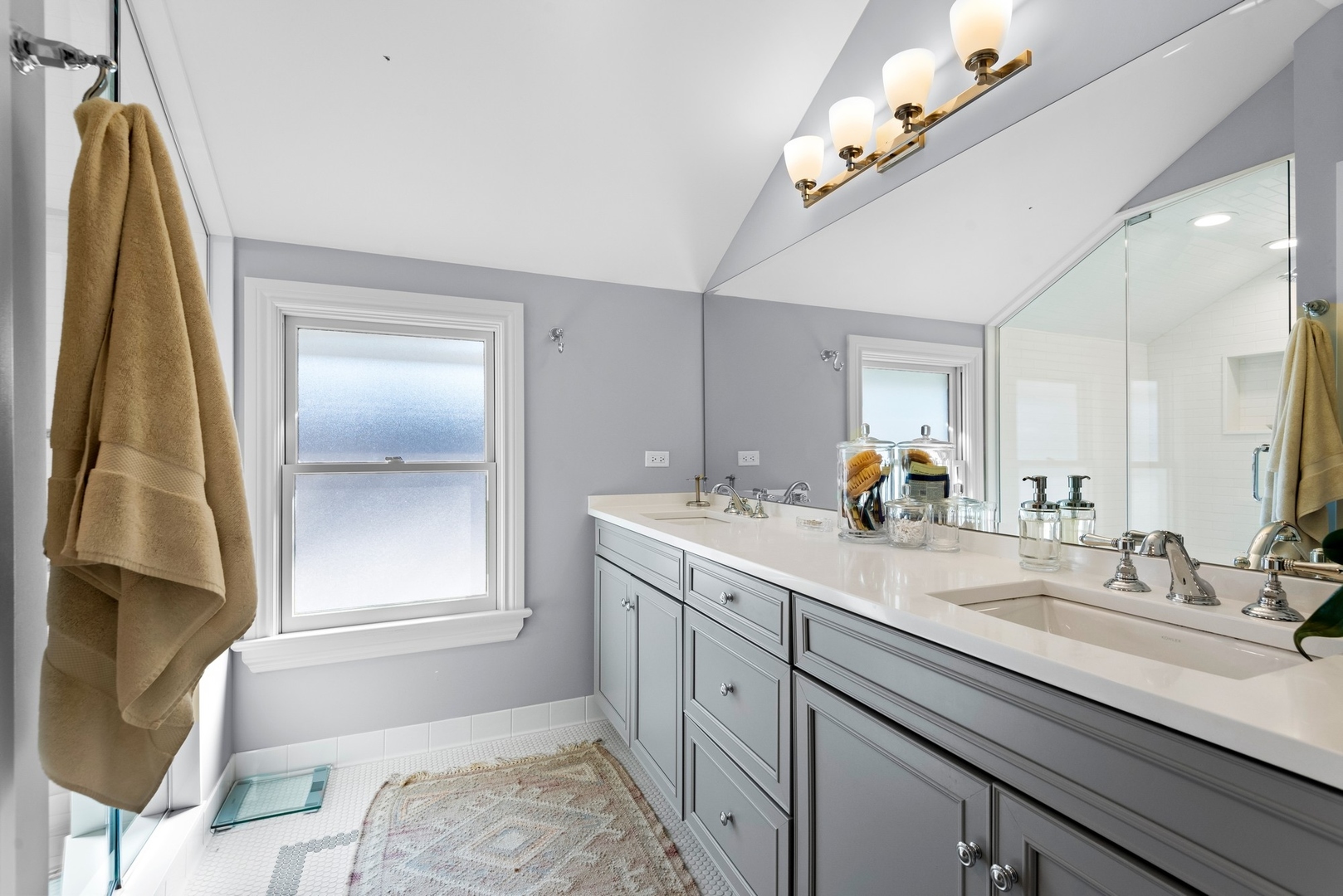 Undisclosed Address Evanston, IL 60201 - Photo 15 of 27 a spacious bathroom with a double vanity sink and a mirror