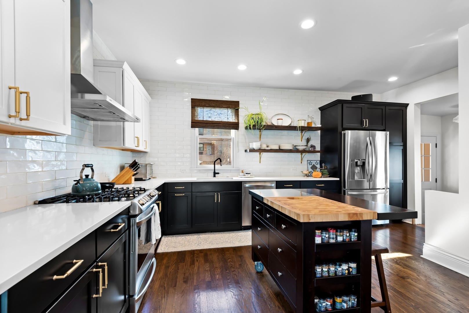 Undisclosed Address Evanston, IL 60201 - Photo 6 of 27 a kitchen with stainless steel appliances granite countertop a sink stove and refrigerator