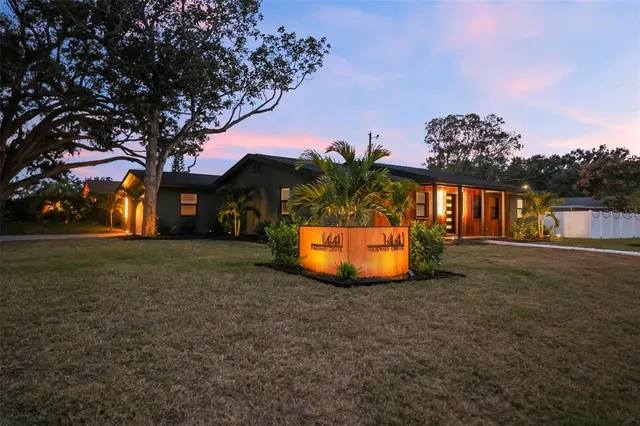 a view of a house with a yard