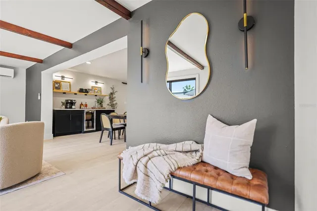 a kitchen with stainless steel appliances a sink cabinets and a window