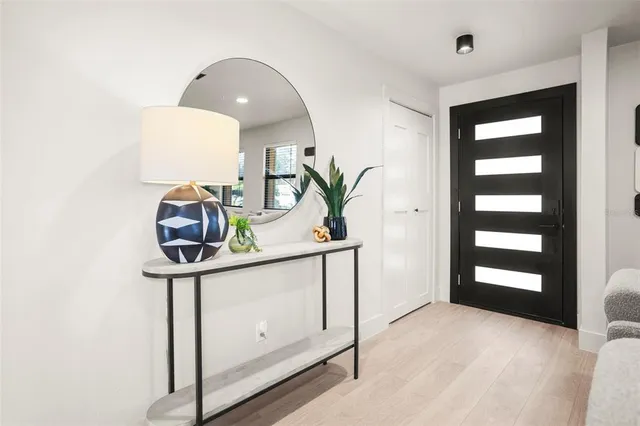 a view of a hallway with paintings on the wall