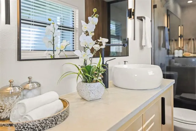 a front view of a house with a yard and a garage