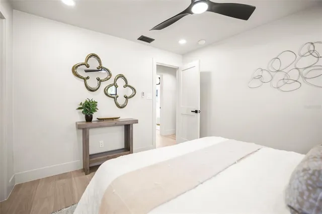 a view of a big house with a big yard and large trees