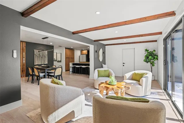 a kitchen with kitchen island a counter top space a sink stainless steel appliances and cabinets