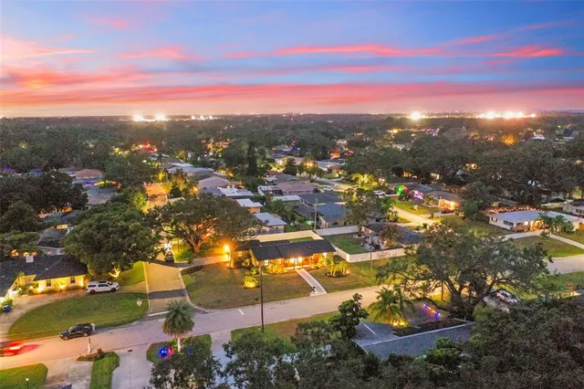 an aerial view of residential building with parking