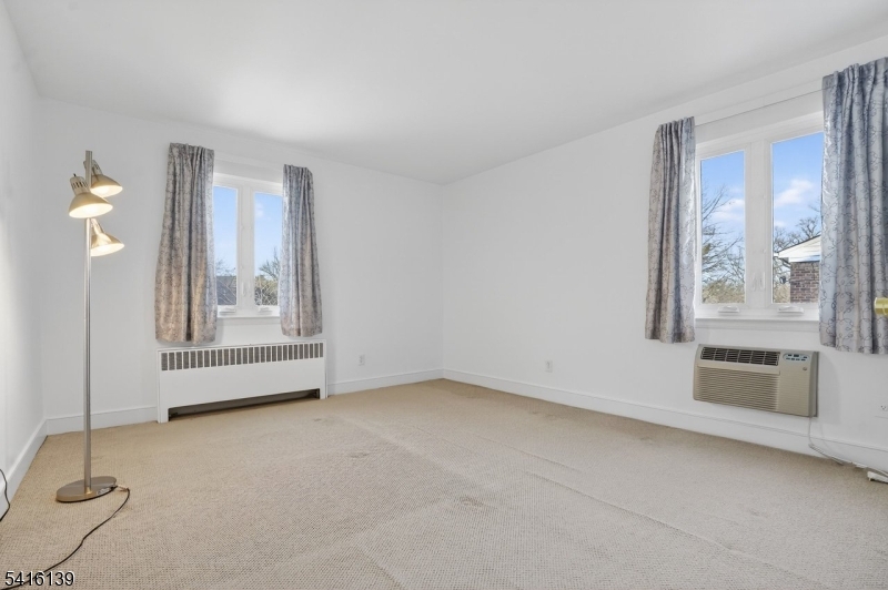 10 Troy Drive, Unit 10A Springfield, NJ 07081 - Photo 13 of 23 a view of an empty room with a window
