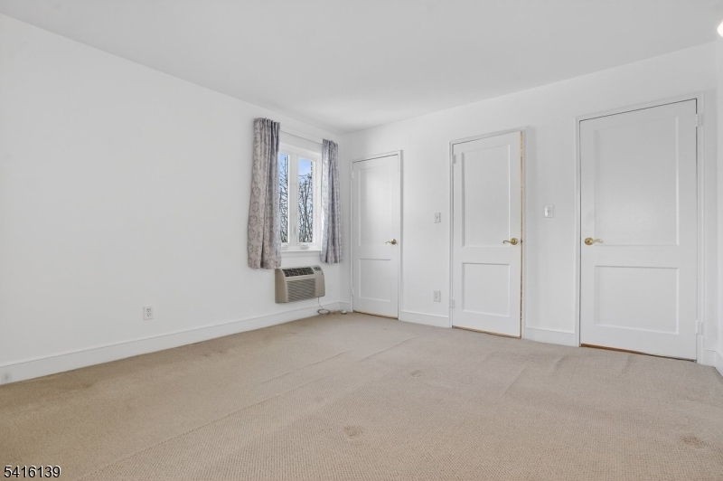 10 Troy Drive, Unit 10A Springfield, NJ 07081 - Photo 14 of 23 a view of an empty room and entryway
