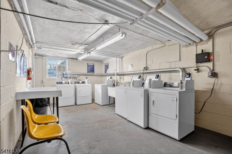 10 Troy Drive, Unit 10A Springfield, NJ 07081 - Photo 18 of 23 a utility room with dryer and washer