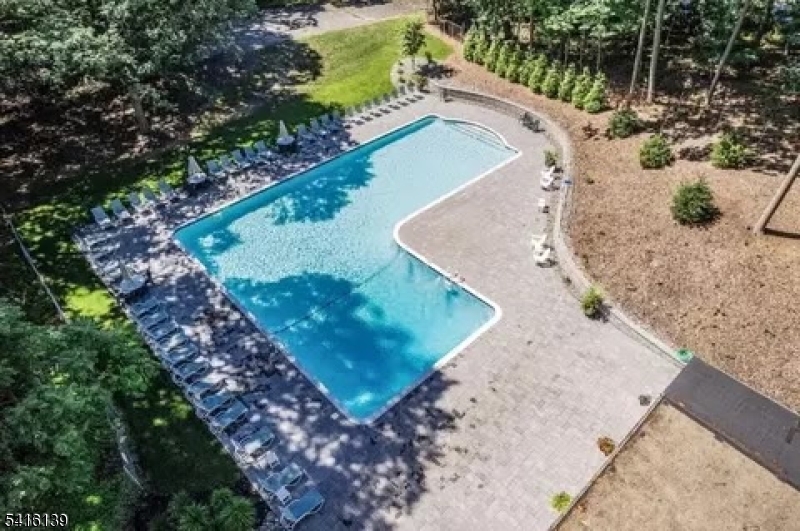 10 Troy Drive, Unit 10A Springfield, NJ 07081 - Photo 20 of 23 a view of a yard with a patio