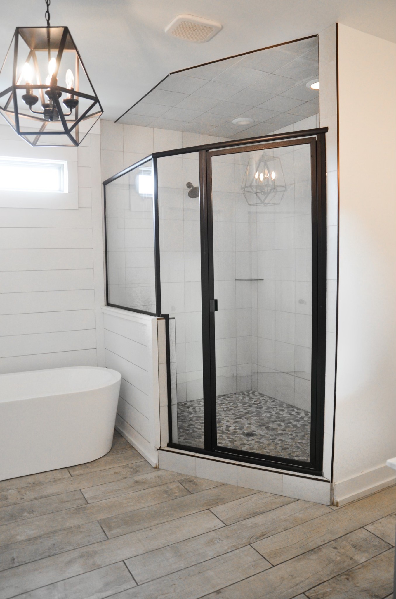 5931 Lakeview Road Springfield, TN 37172 - Photo 26 of 55 a view of a bathroom with a glass door shower and a mirror