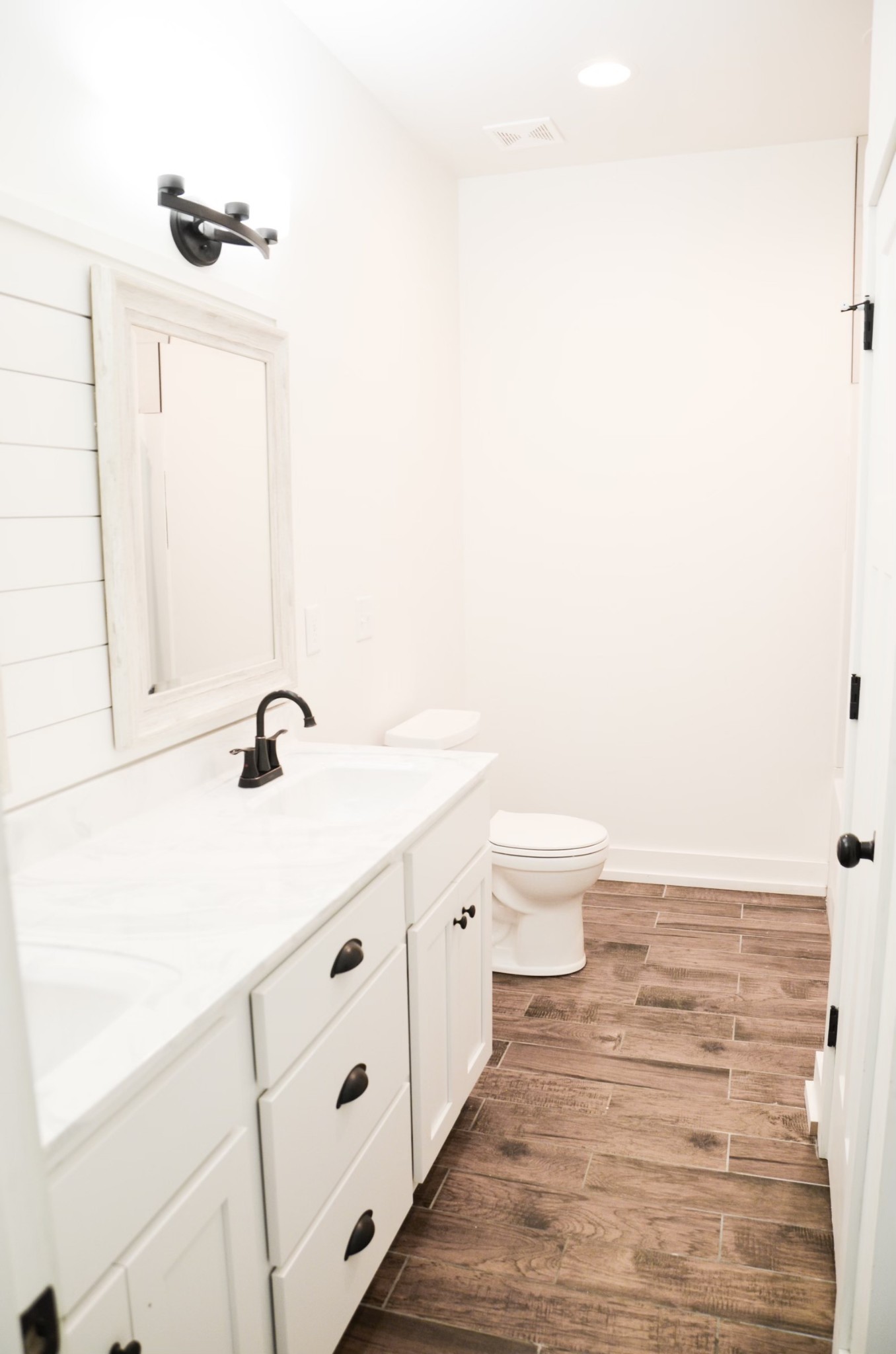 5931 Lakeview Road Springfield, TN 37172 - Photo 33 of 55 a bathroom with a sink a toilet and a mirror