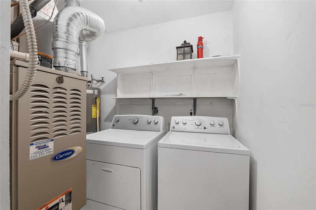 8305 Southwest 46 Lane Gainesville, FL 32608 - Photo 26 of 65 a utility room with dryer and washer