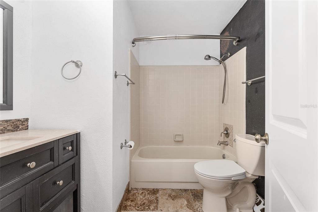 8305 Southwest 46 Lane Gainesville, FL 32608 - Photo 38 of 65 a bathroom with a toilet a sink and shower