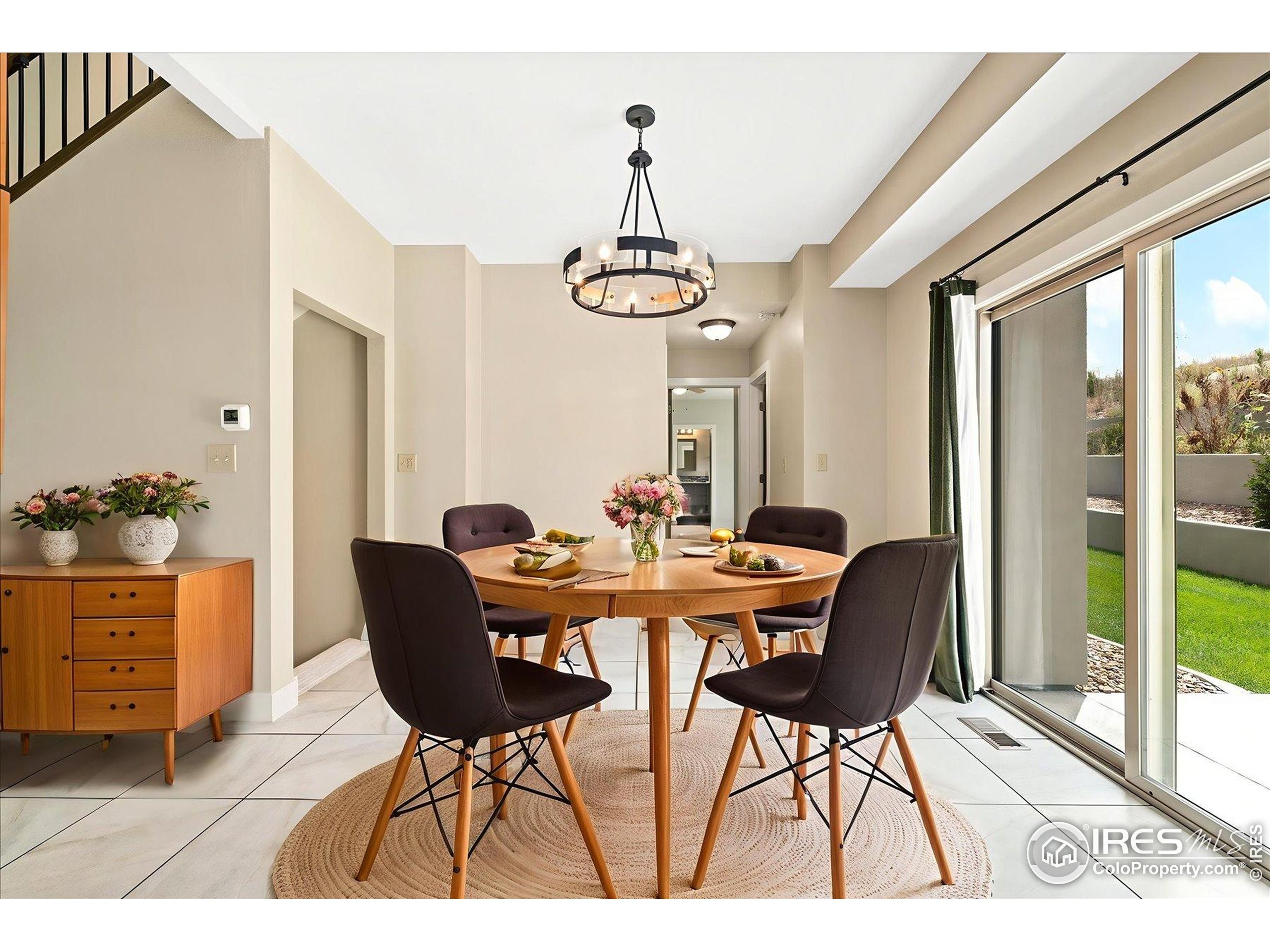 403 Double Tree Drive Greeley, CO 80634 - Photo 13 of 49 a view of a dining room with furniture window and wooden floor