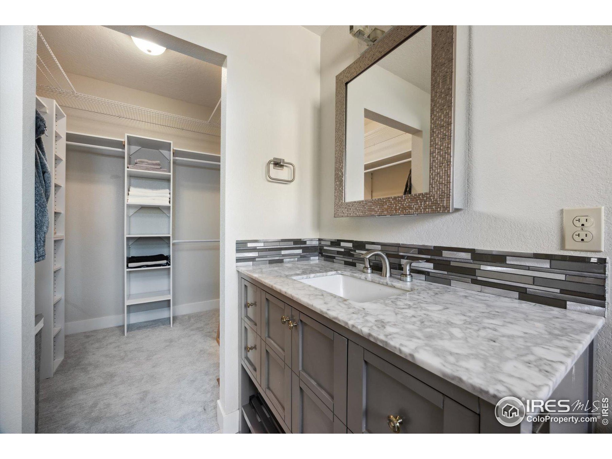 403 Double Tree Drive Greeley, CO 80634 - Photo 18 of 49 a bathroom with a sink and a mirror