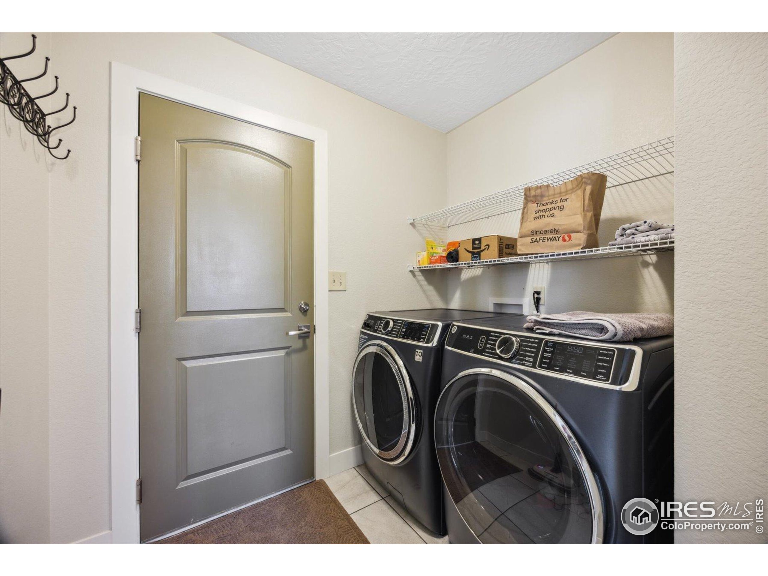 403 Double Tree Drive Greeley, CO 80634 - Photo 20 of 49 a utility room with dryer and washer