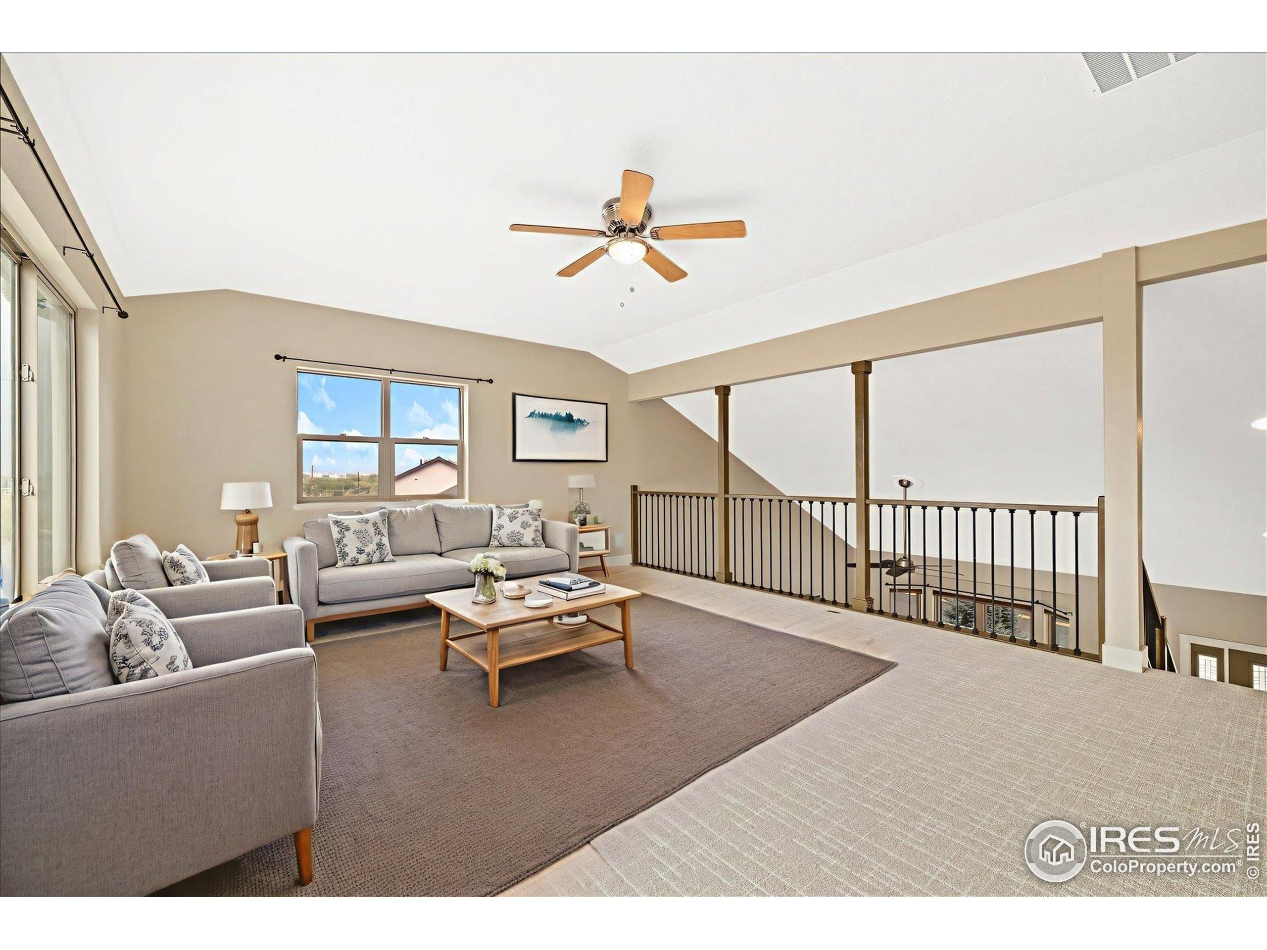 403 Double Tree Drive Greeley, CO 80634 - Photo 21 of 49 a living room with furniture and a large window