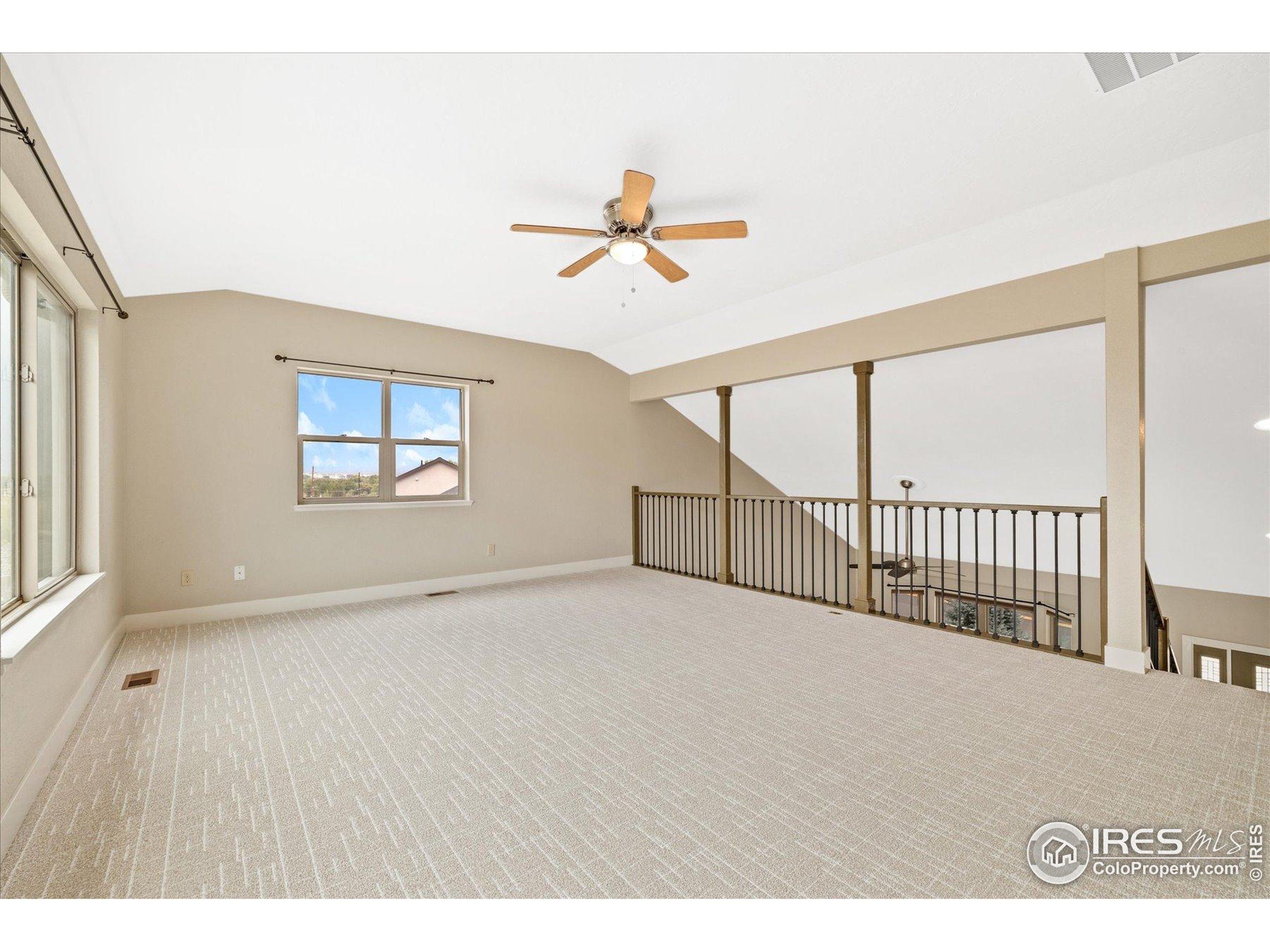 403 Double Tree Drive Greeley, CO 80634 - Photo 22 of 49 a view interior of a house with wooden floor and windows