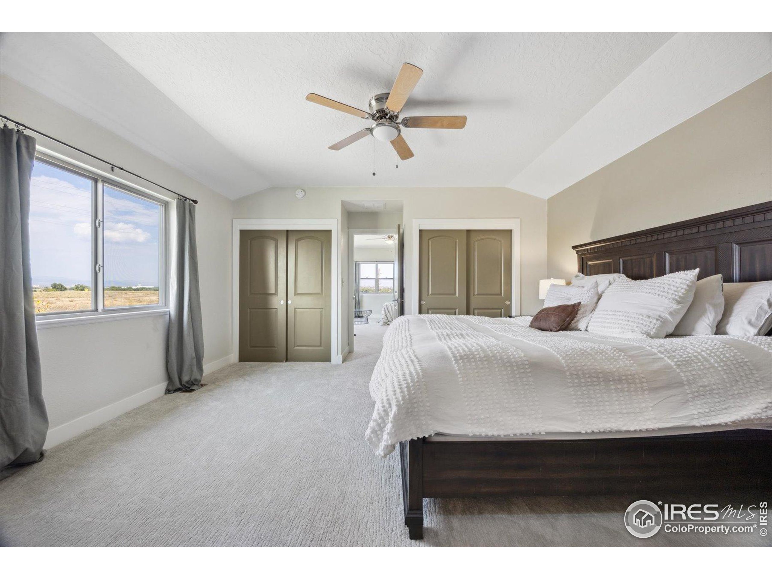 403 Double Tree Drive Greeley, CO 80634 - Photo 25 of 49 a bedroom with a bed and window