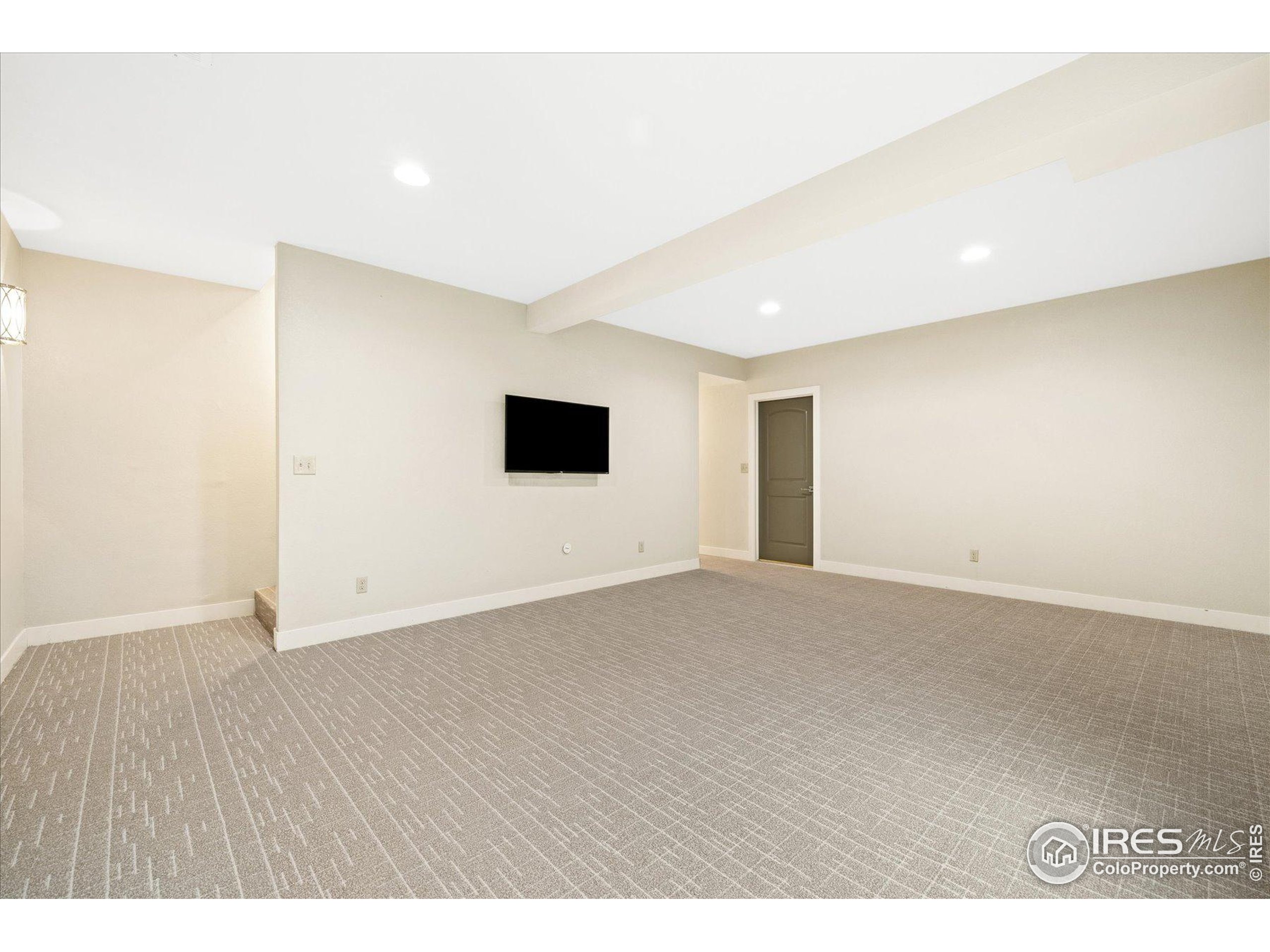 403 Double Tree Drive Greeley, CO 80634 - Photo 32 of 49 a view of an empty room with wooden floor