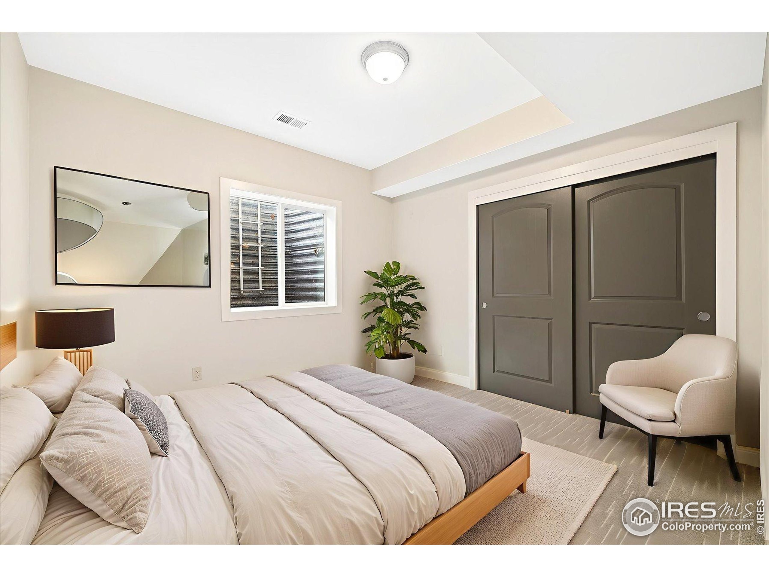 403 Double Tree Drive Greeley, CO 80634 - Photo 33 of 49 a bedroom with a bed and a couch