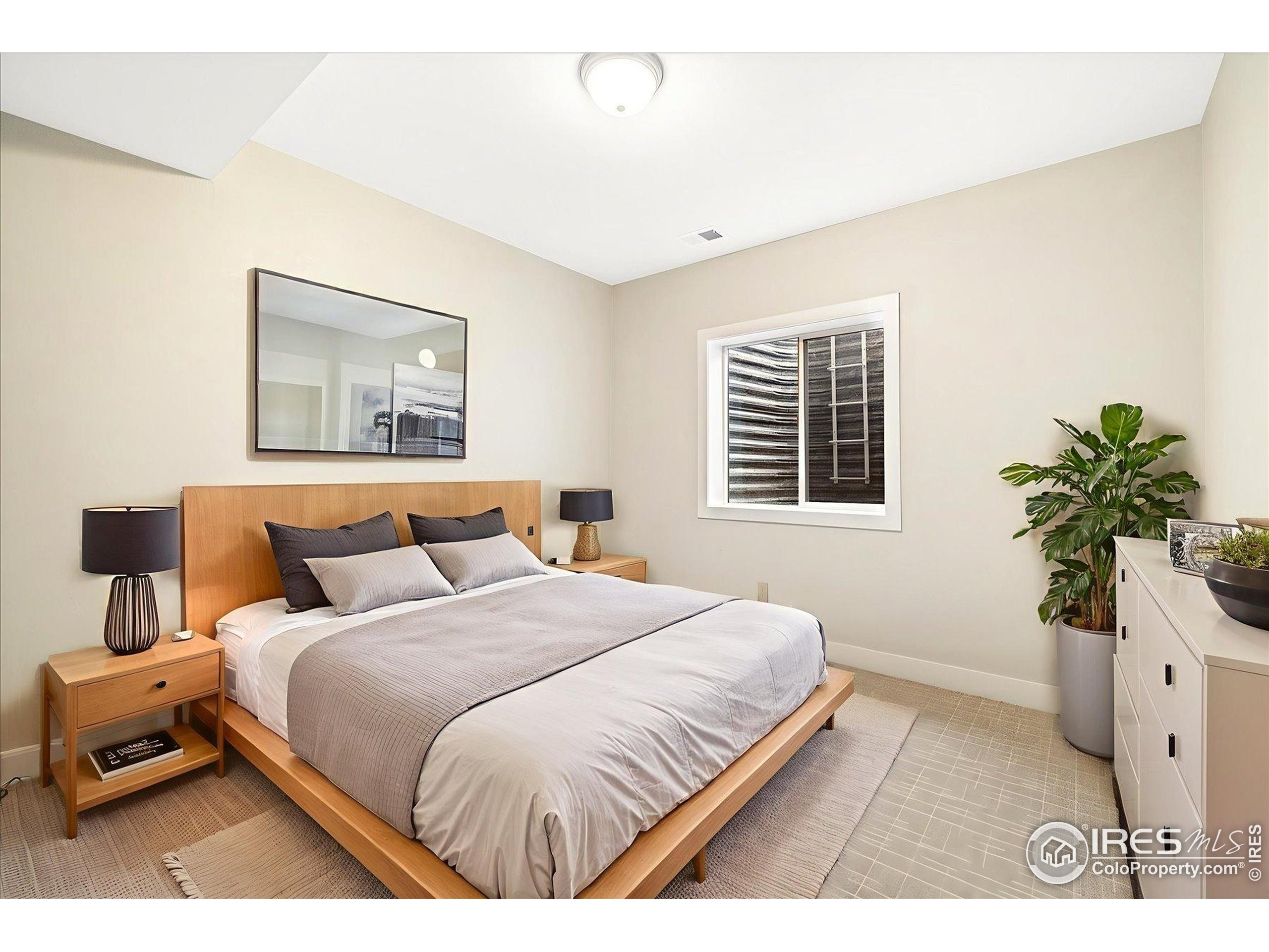 403 Double Tree Drive Greeley, CO 80634 - Photo 35 of 49 a bedroom with a bed and a window