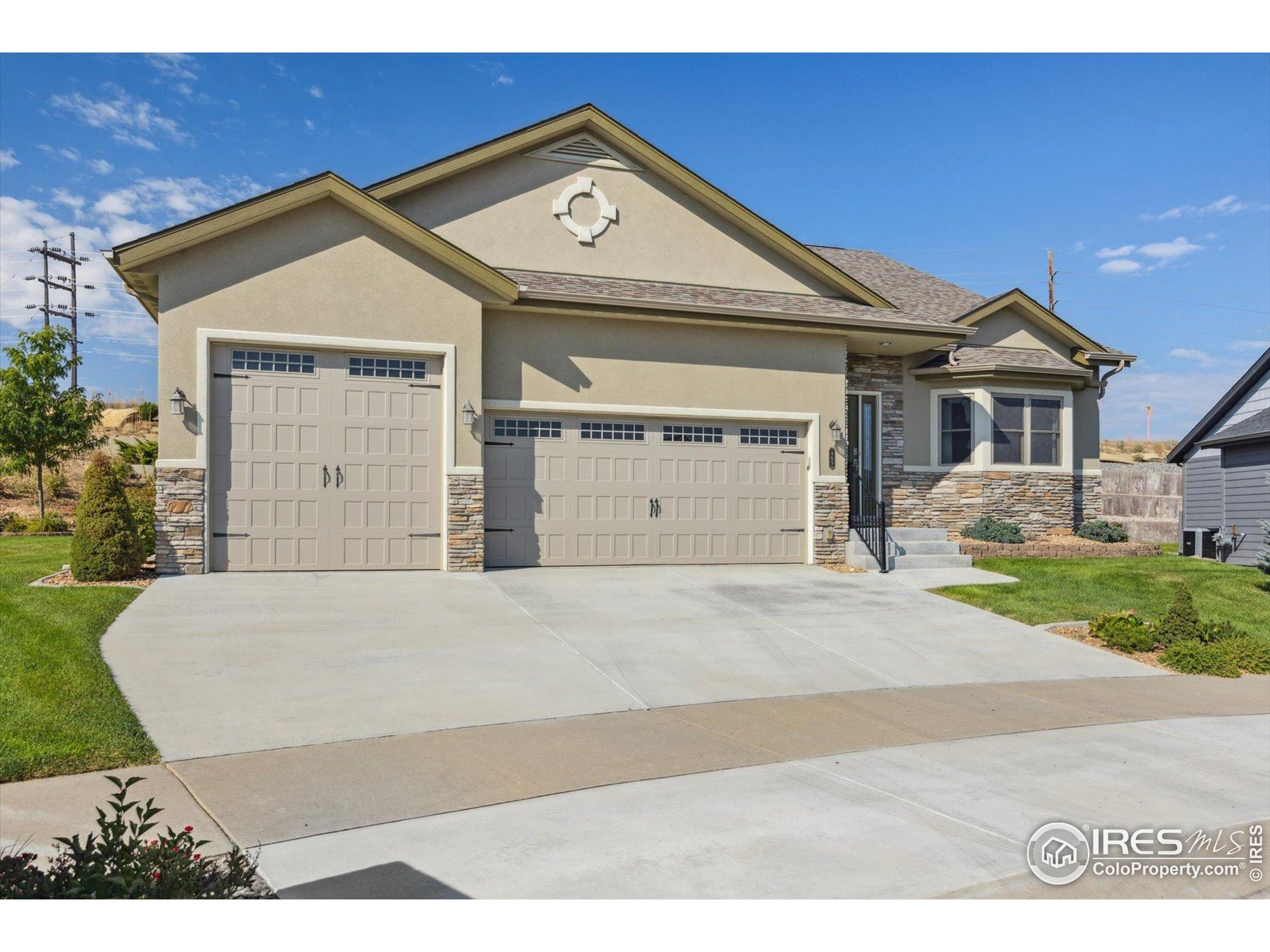 403 Double Tree Drive Greeley, CO 80634 - Photo 41 of 49 a front view of a house with a yard and garage