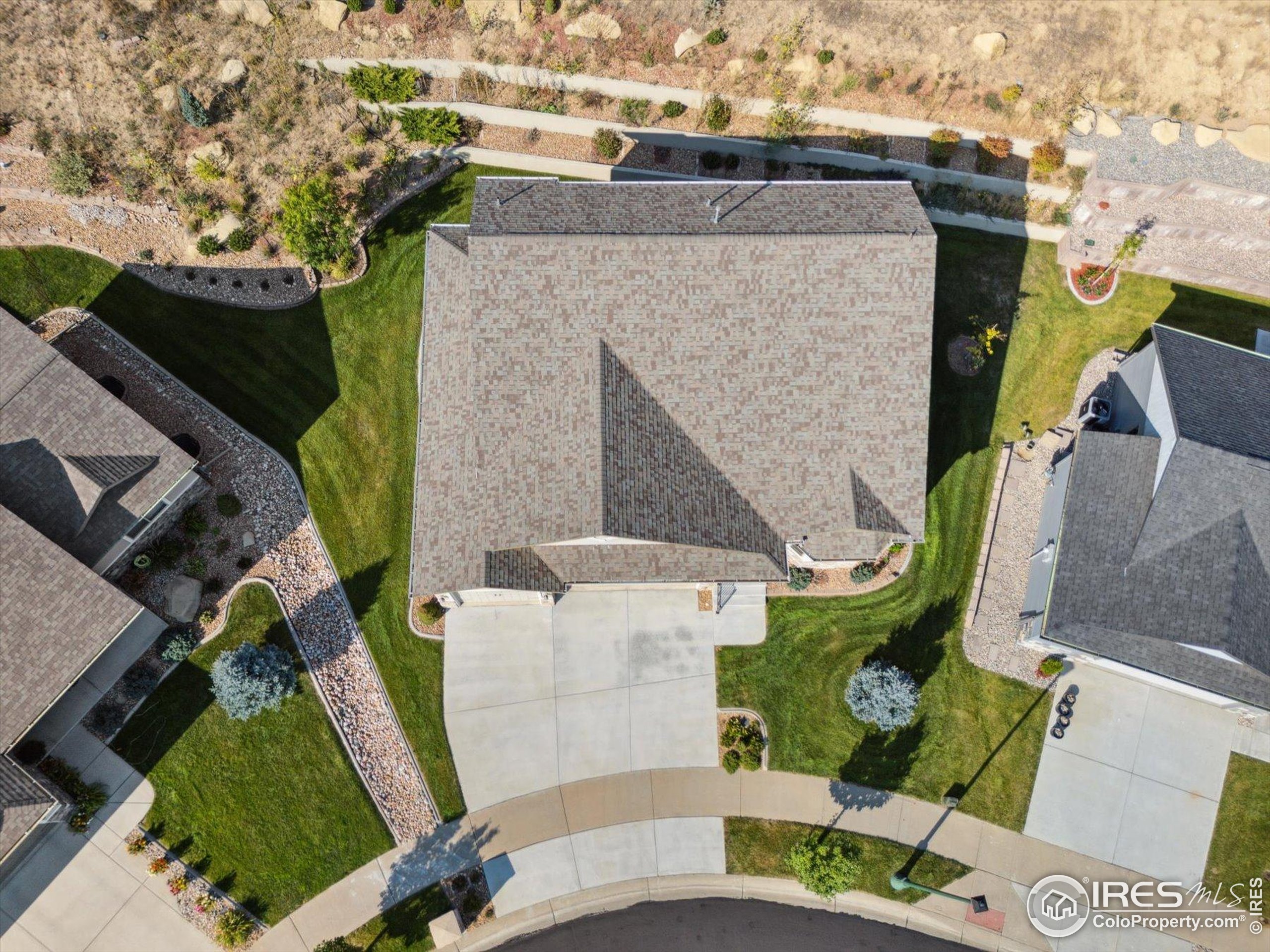 403 Double Tree Drive Greeley, CO 80634 - Photo 43 of 49 an aerial view of a house with a yard and potted plants