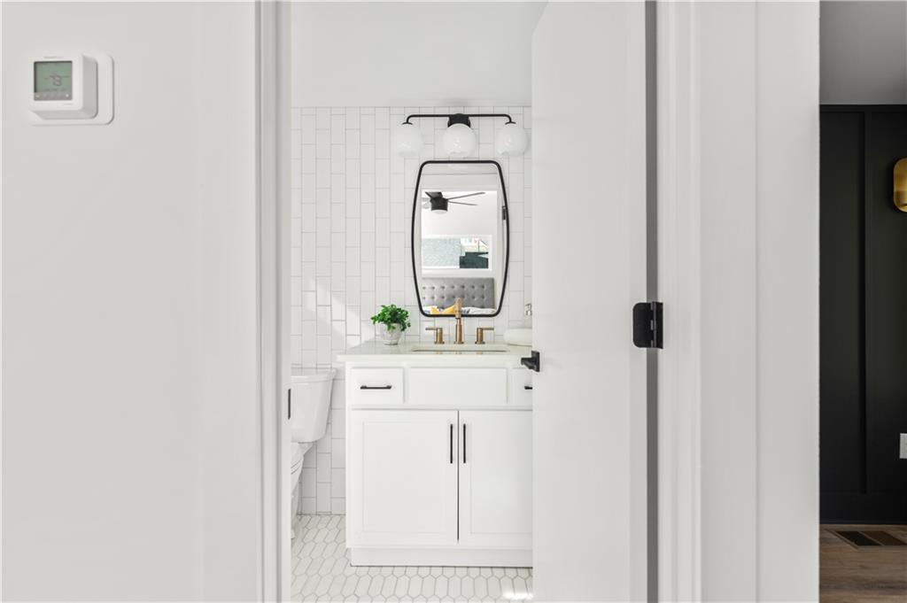 845 Ormewood Terrace Southeast, Unit B Atlanta, GA 30316 - Photo 11 of 32 a picture of a bathroom with a sink and a mirror