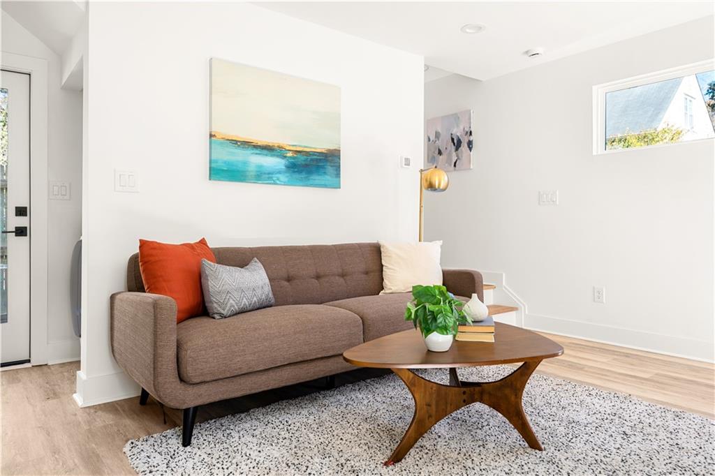 845 Ormewood Terrace Southeast, Unit B Atlanta, GA 30316 - Photo 16 of 32 a living room with furniture and wooden floor