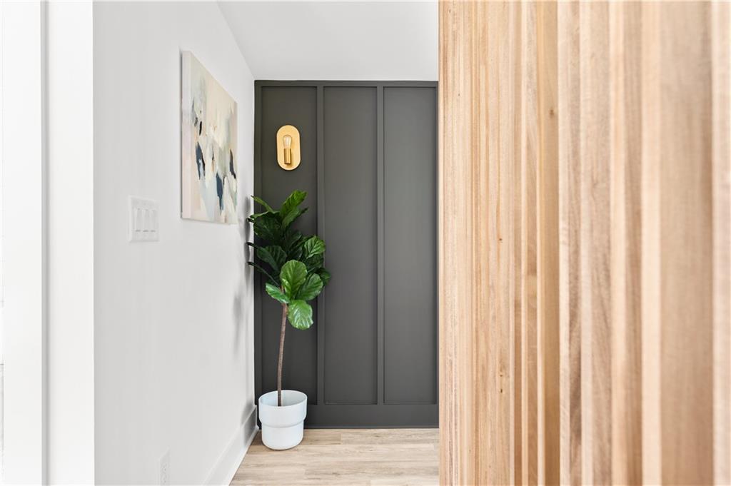 845 Ormewood Terrace Southeast, Unit B Atlanta, GA 30316 - Photo 18 of 32 a vase of flowers sitting on a wooden floor