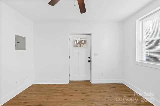 a view of kitchen with wooden floor and window