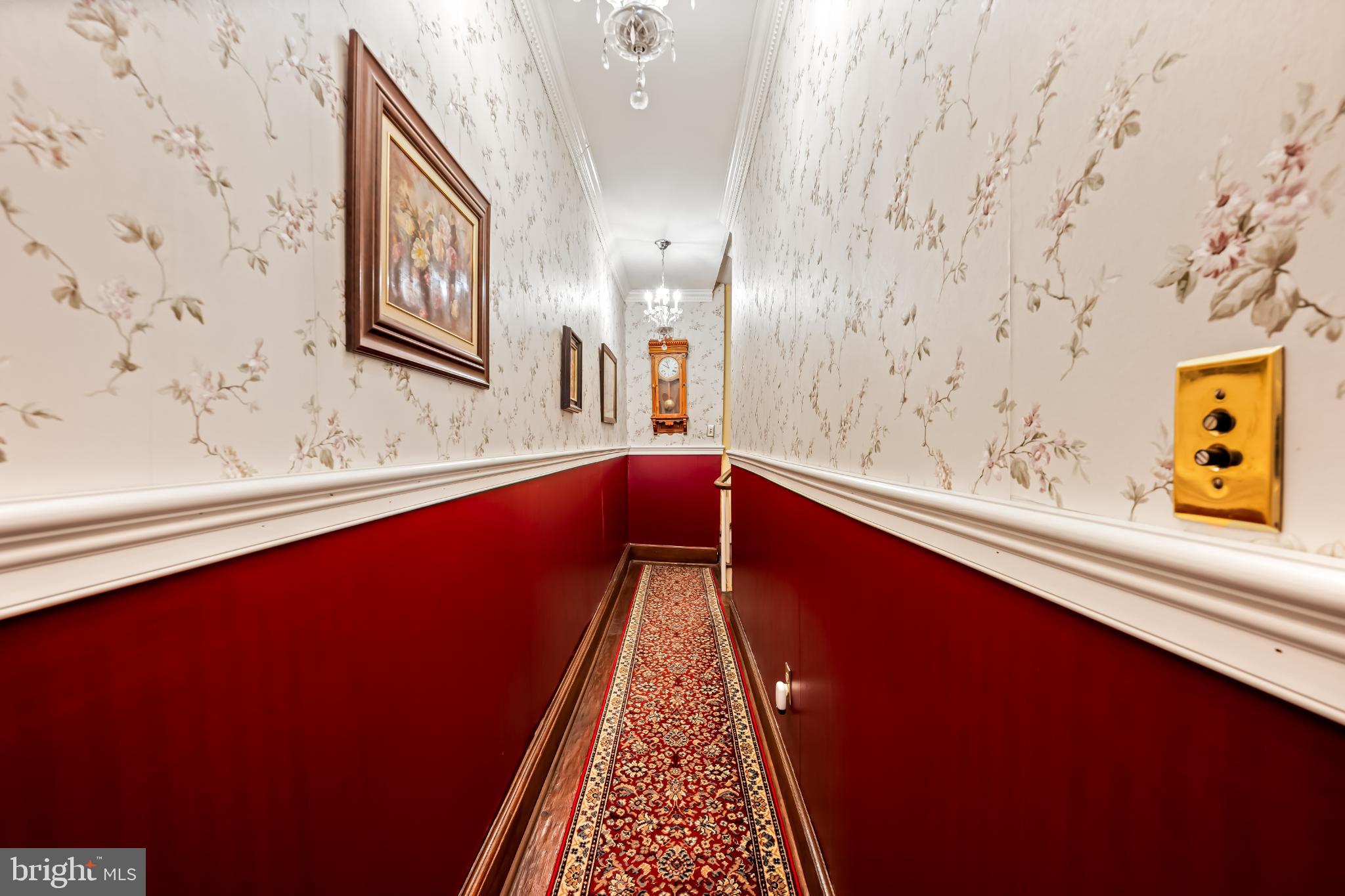 35 South Calhoun Street Baltimore, MD 21223 - Photo 21 of 29 Elegant hallway with rich red accents.
