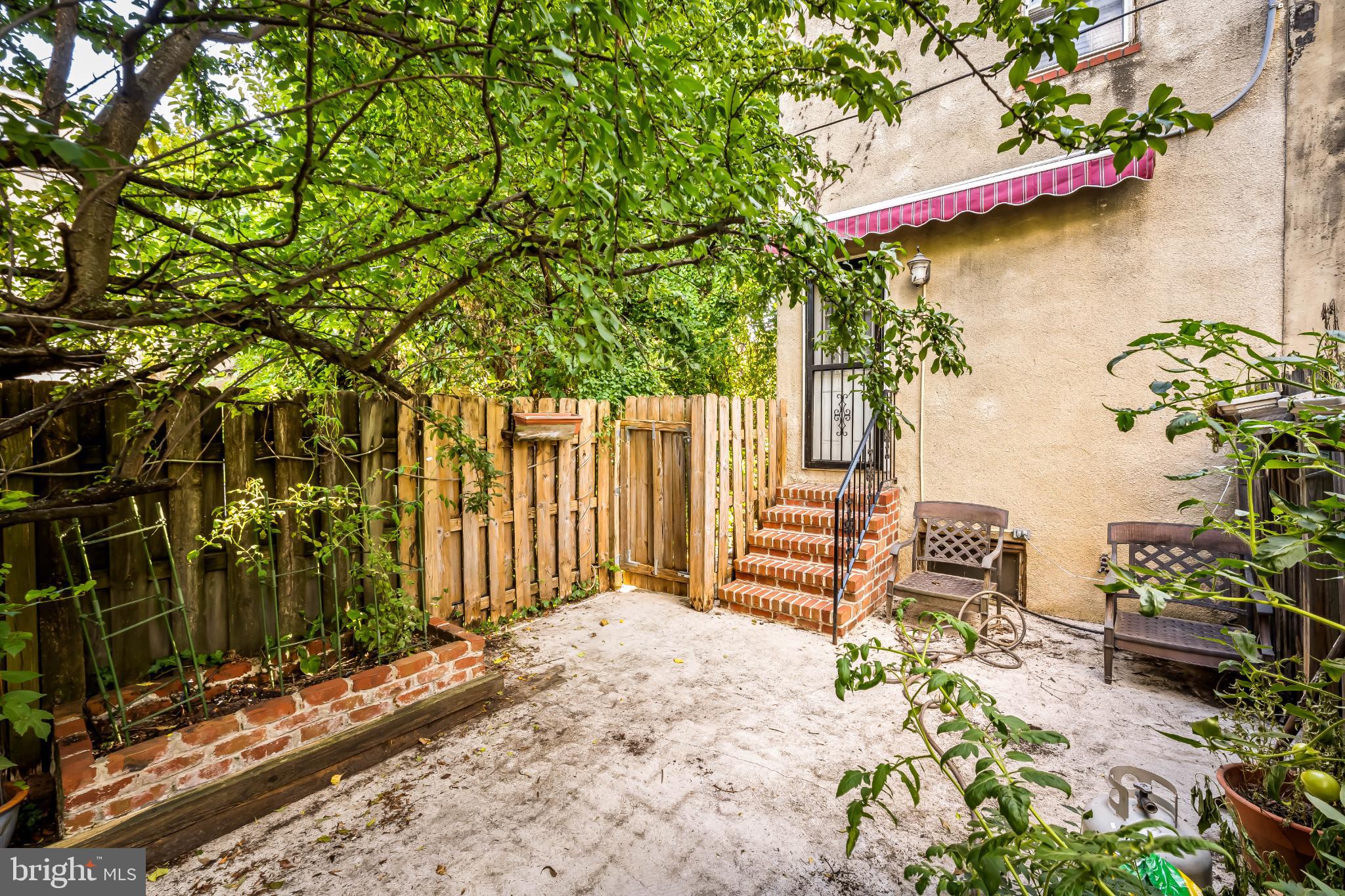 35 South Calhoun Street Baltimore, MD 21223 - Photo 27 of 29 Charming outdoor retreat with lush greenery.