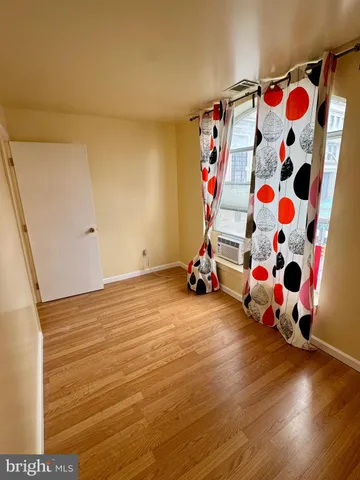 a view of room with toys and wooden floor
