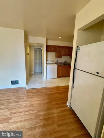 a view of kitchen and wooden floor
